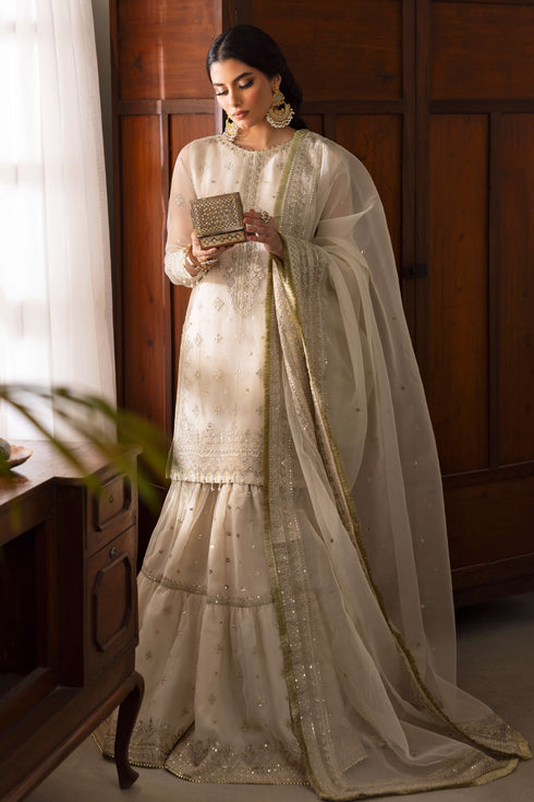 Close-up of NAQSHI Jeena gypsy gharara in organza with lavender hue detailing, embroidered borders, sequins and flowy flare.